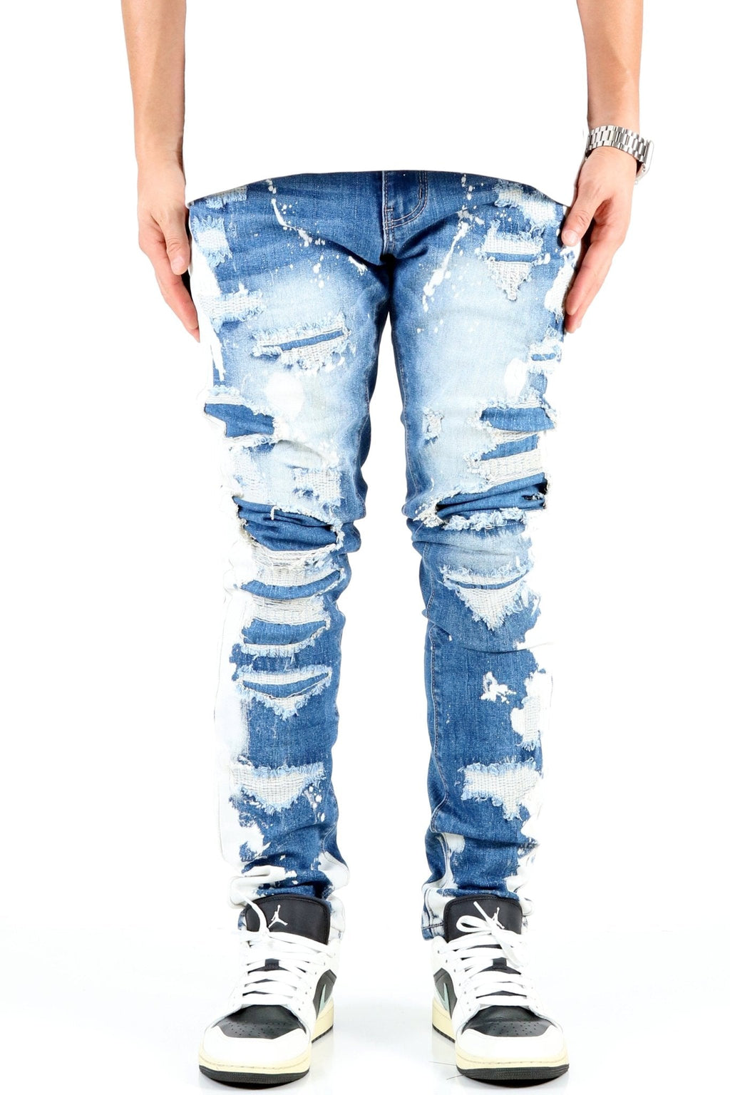 SAVAGE acid-washed skinny jeans - front view rip and repair