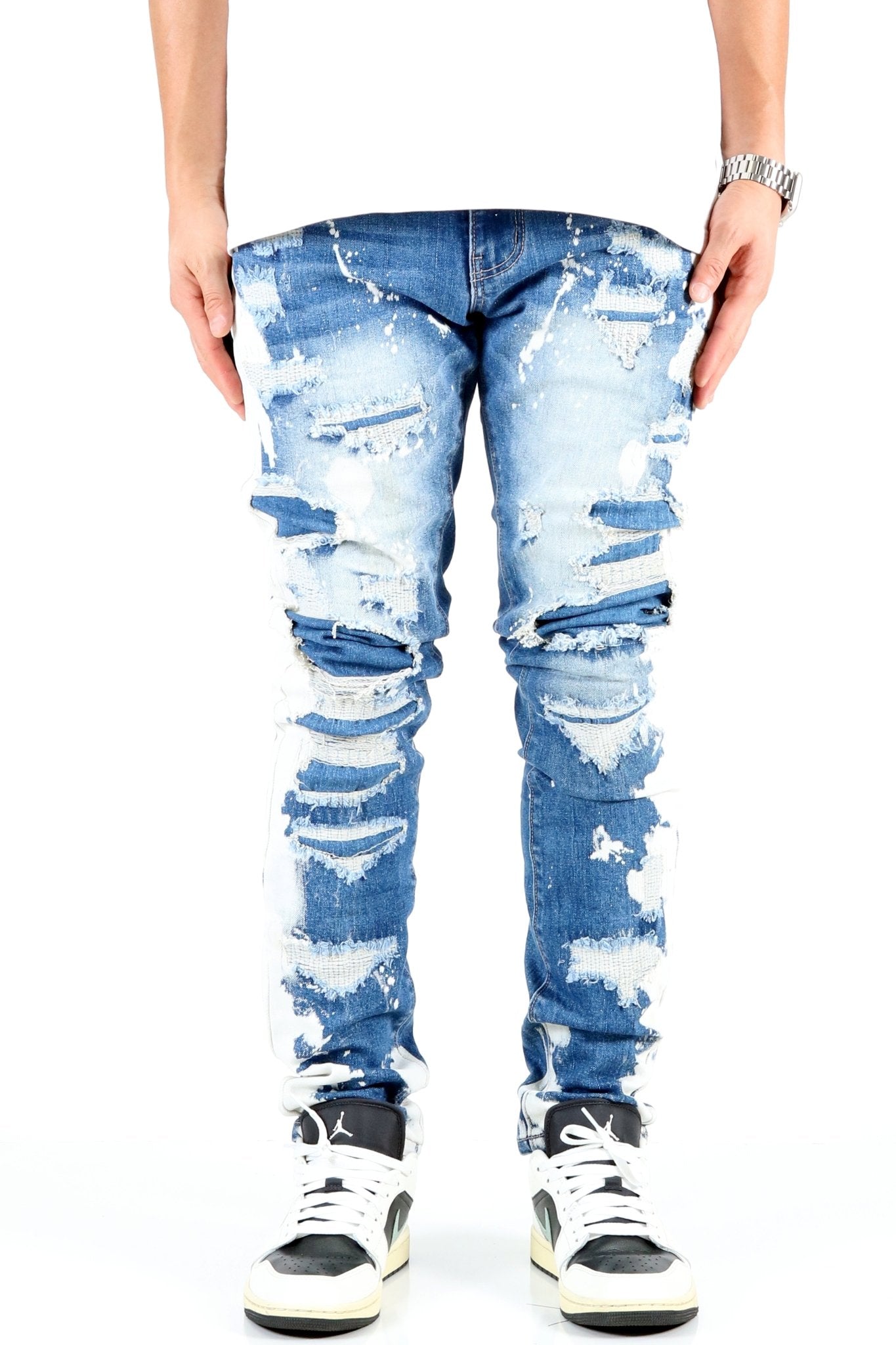 SAVAGE acid-washed skinny jeans - front view rip and repair