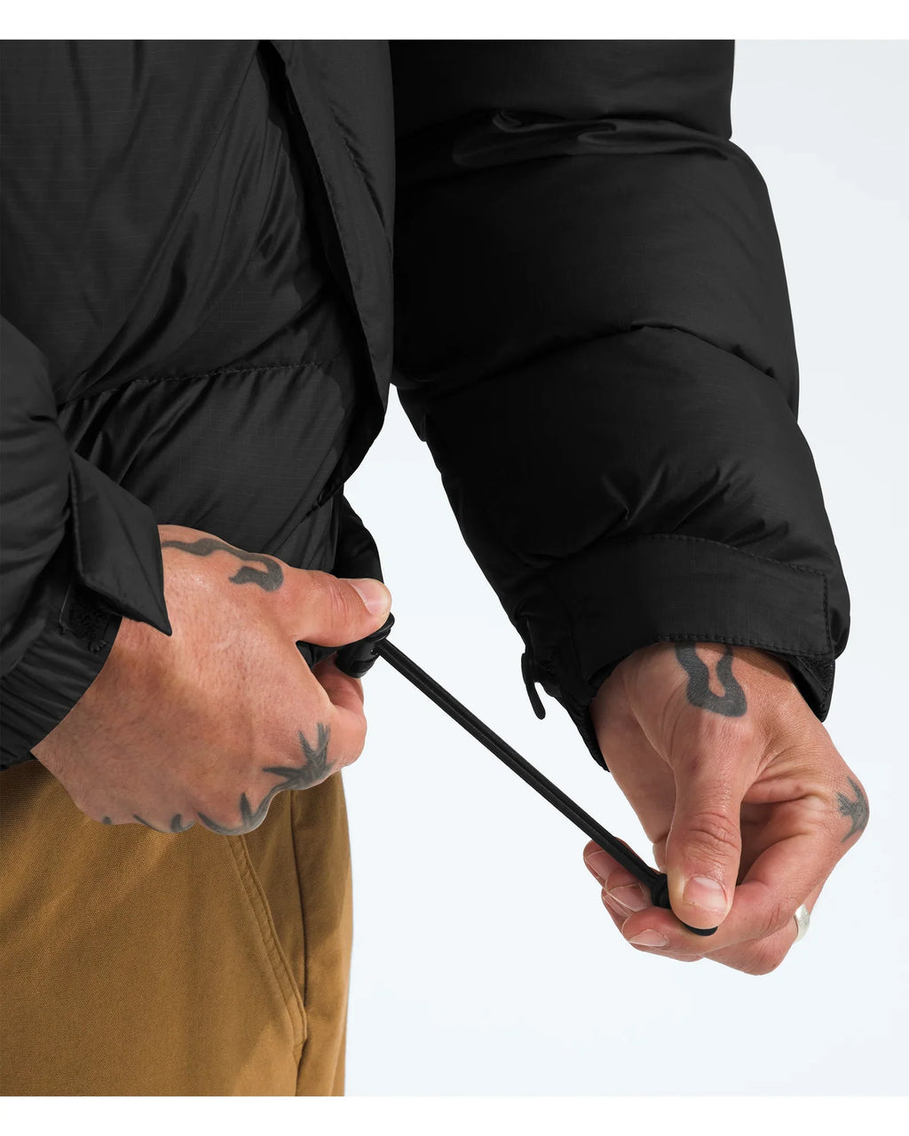 The North Face Nuptse Black Jacket - Detail of zipper and pockets
